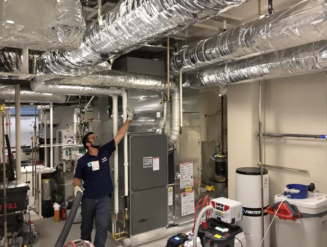 Scituate Air Duct Cleaning specialist performing thorough furnace duct cleaning in a Scituate residence